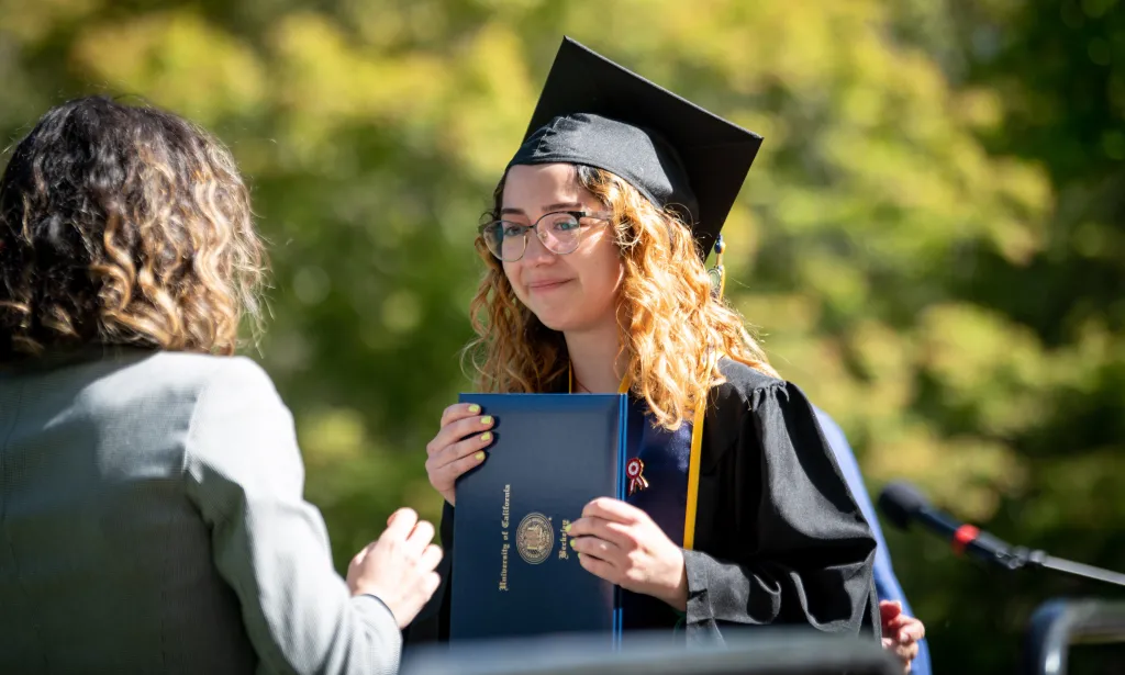 A college graduate photographed after receiving her diploma