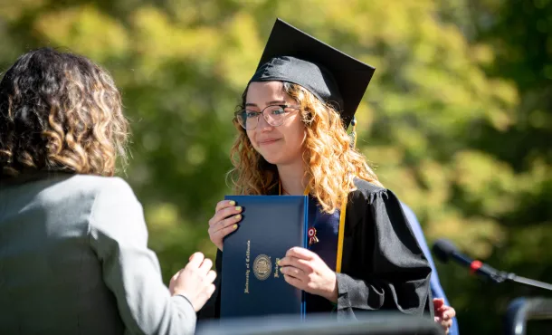 A college graduate photographed after receiving her diploma