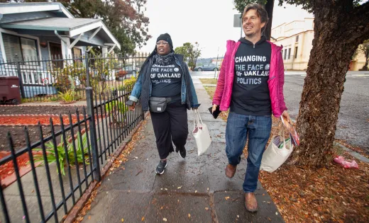 Oakland community canvassers walking in a residential neighborhood