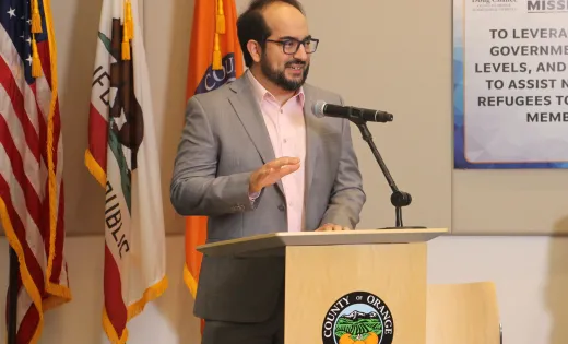 Masih Fouladi photographed speaking at an event