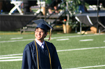 New at his high school graduation