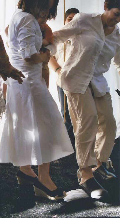 Rachel and Felicia break the glass at their wedding