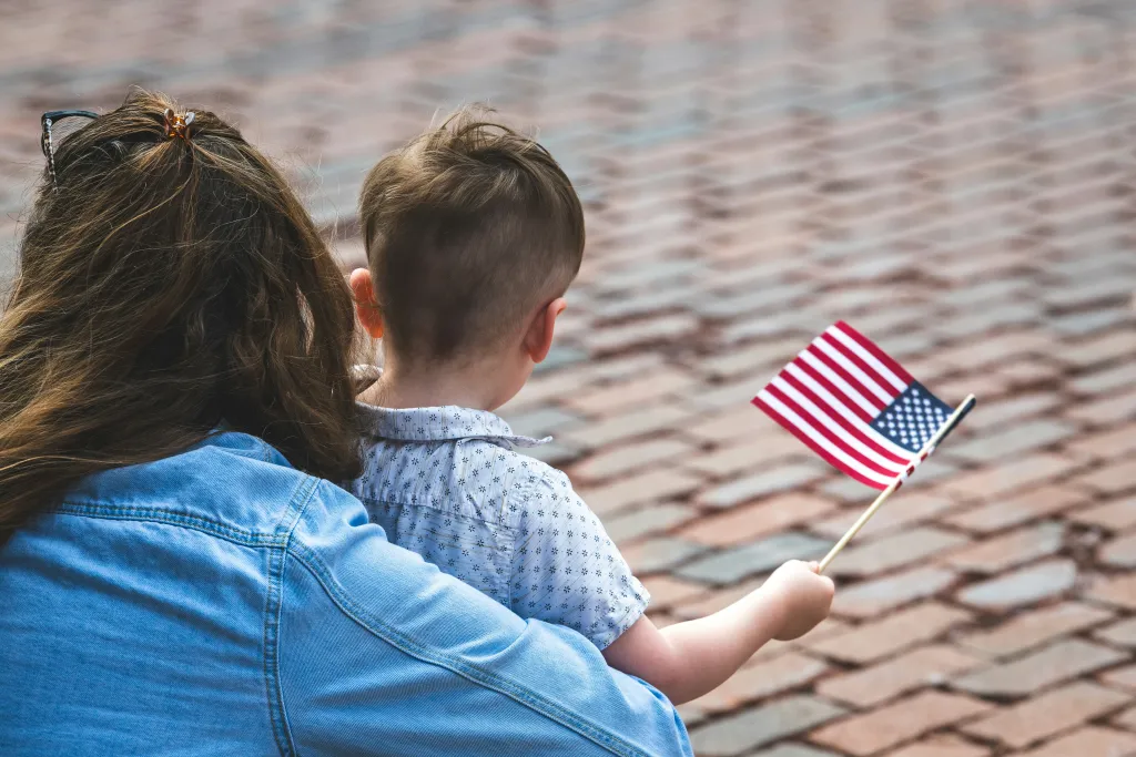Child holding American Flag