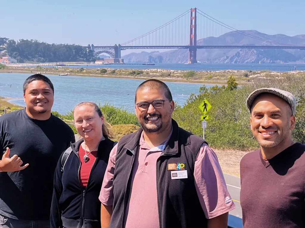 Haas Jr. Vice President of Programs, Robert Joseph, and Program Associate, Lisa Marquez-Valenti with Ernesto Pepito and Dylan Nepomuceno of the Crissy Field Center 