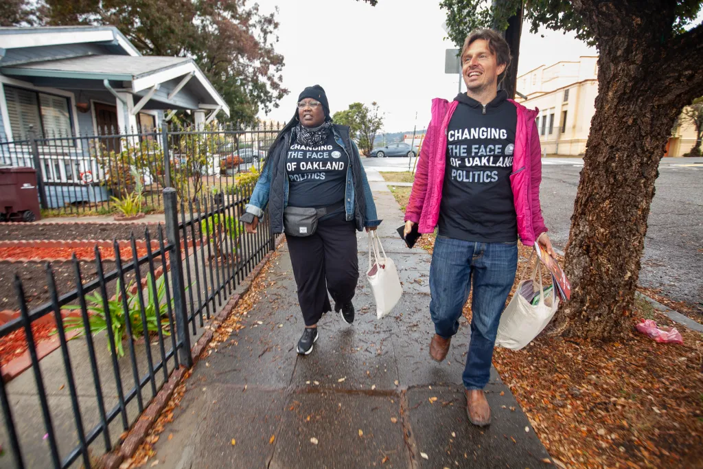 Oakland community canvassers walking in a residential neighborhood