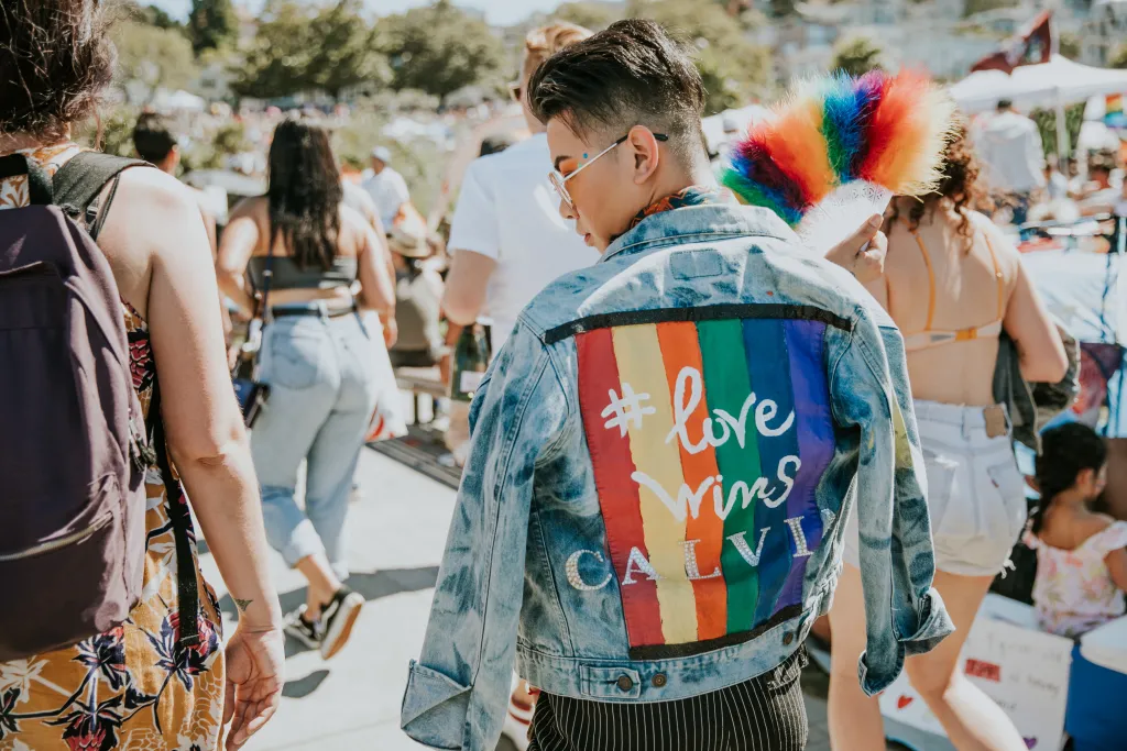 Photo of person wearing jacket that says "Love Wins"