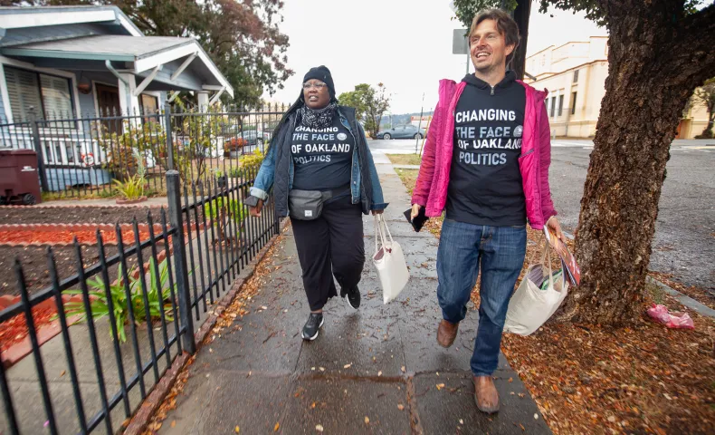 Oakland community canvassers walking in a residential neighborhood