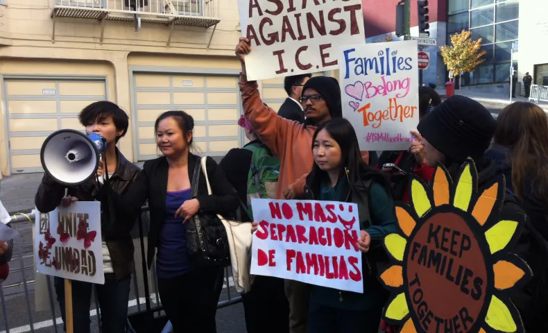 Asian community members march for immigrant rights