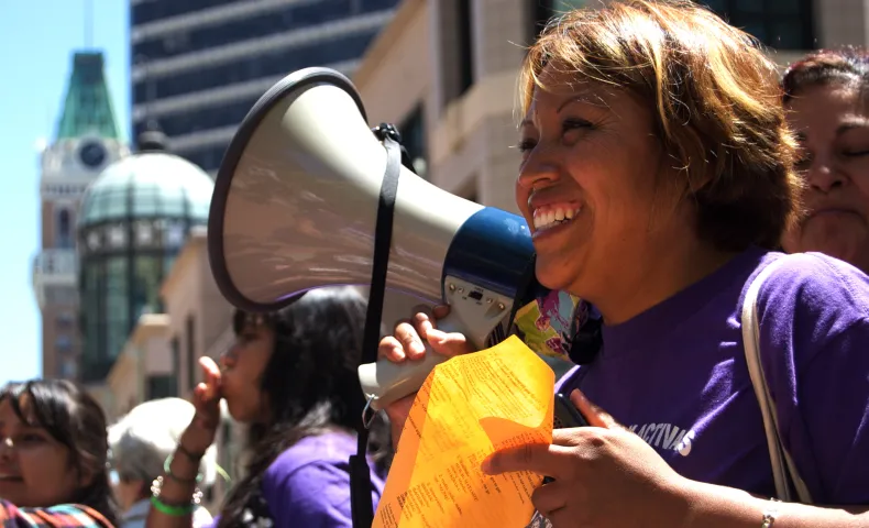 Woman at protest with megaphone