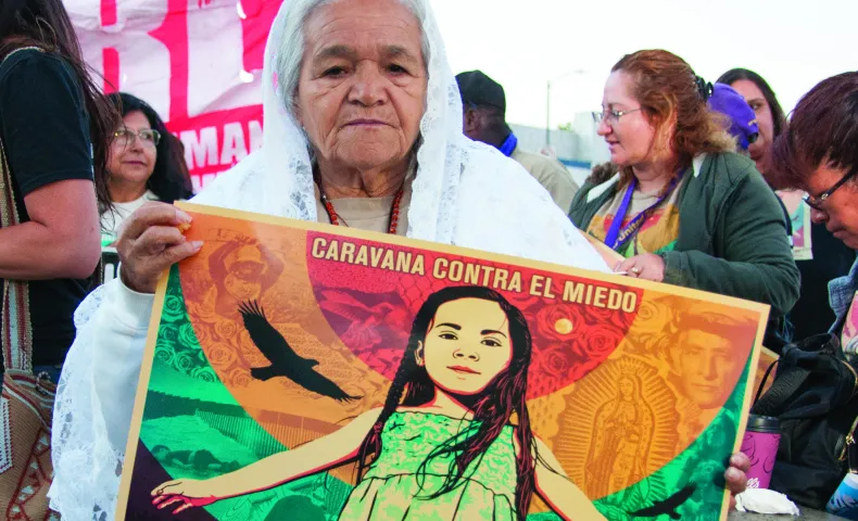 Members of CHIRLA and other immigrant rights coalitions gather at the break of dawn on Wilshire Boulevard and Alvarado Street to demand dignity and respect as part of the Caravana Contra el Miedo.