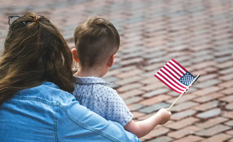 Child holding American Flag