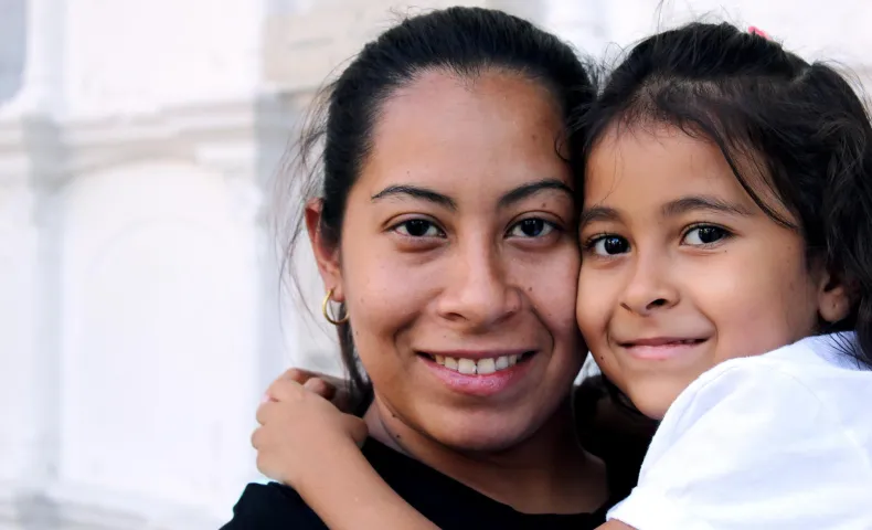 Woman with child in arms