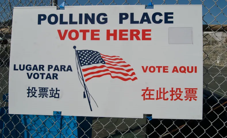 Polling place sign on fence