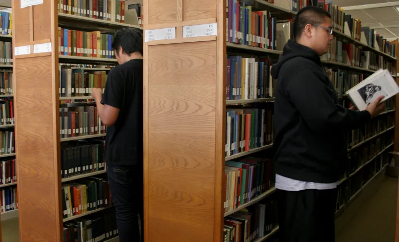 Community college students at the library