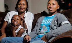 Woman with her teenage son and grade school daughter on a couch