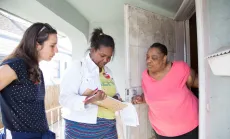 Community organizers seen talking to a local resident.