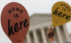 Home is here signs in front of SCOTUS