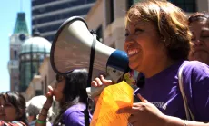 Woman at protest with megaphone