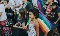 Young Girl with Rainbow Flag 