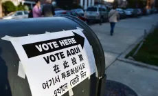 Voting location sign in four different languages