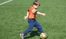 Young boy playing soccer