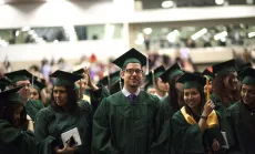 Students graduating in their cap and gown