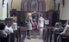 Screencap of family in church from Welcome, Everyone 