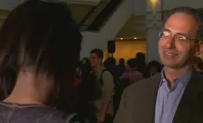 Screencap of Walter J. Haas giving interview 