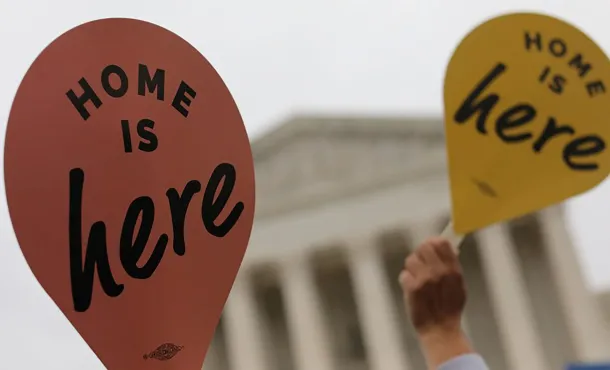 Home is here signs in front of SCOTUS