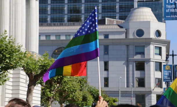 Gay pride flag waves by San Francisco City Hall after SCOTUS announcement
