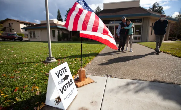 Sign pointing towards polling place