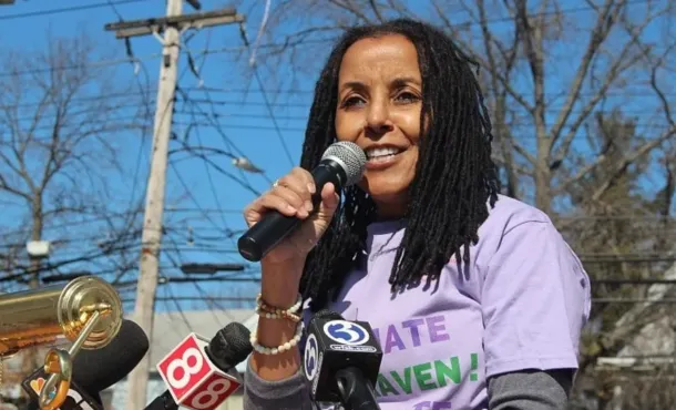 Kica Matos photographed speaking at an event