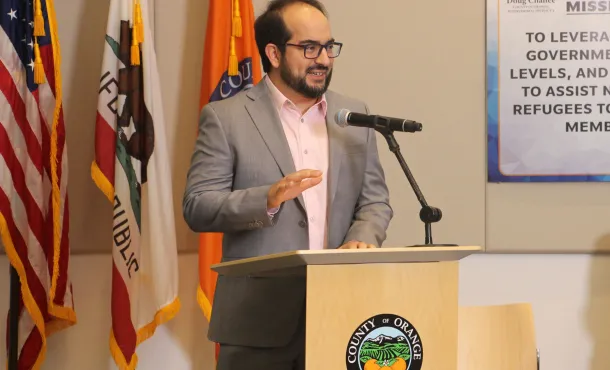 Masih Fouladi photographed speaking at an event
