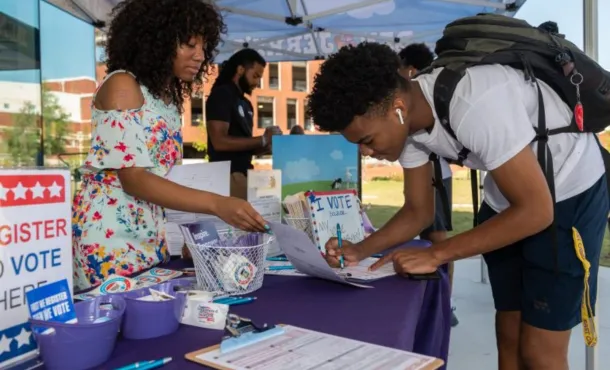 A young person seen registering to vote