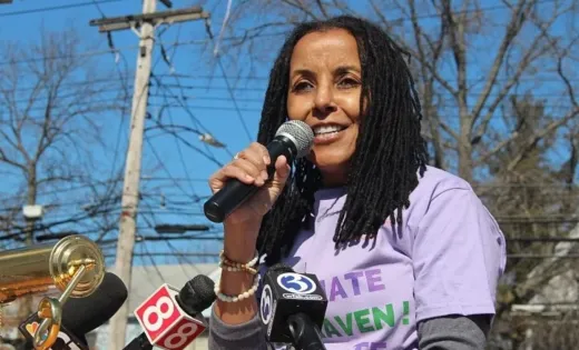 Kica Matos photographed speaking at an event