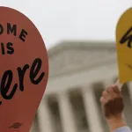 Home is here sign in front of SCOTUS