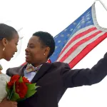 Lesbian couple with american flag on wedding day