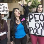 Local organizers demonstrating for fair political redistricting decisions.