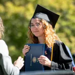 A college graduate photographed after receiving her diploma