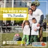 Family with white t-shirts in front on city hall