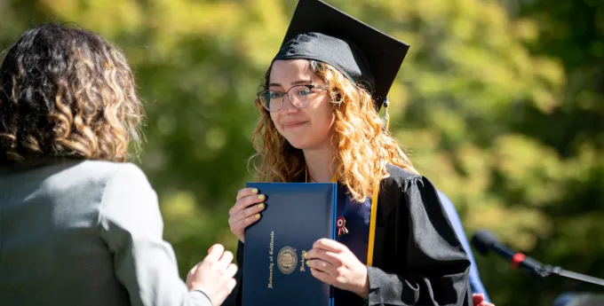A college graduate photographed after receiving her diploma