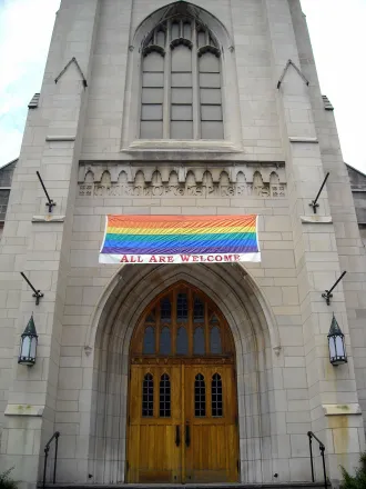 Church with "All Are Welcome" sign